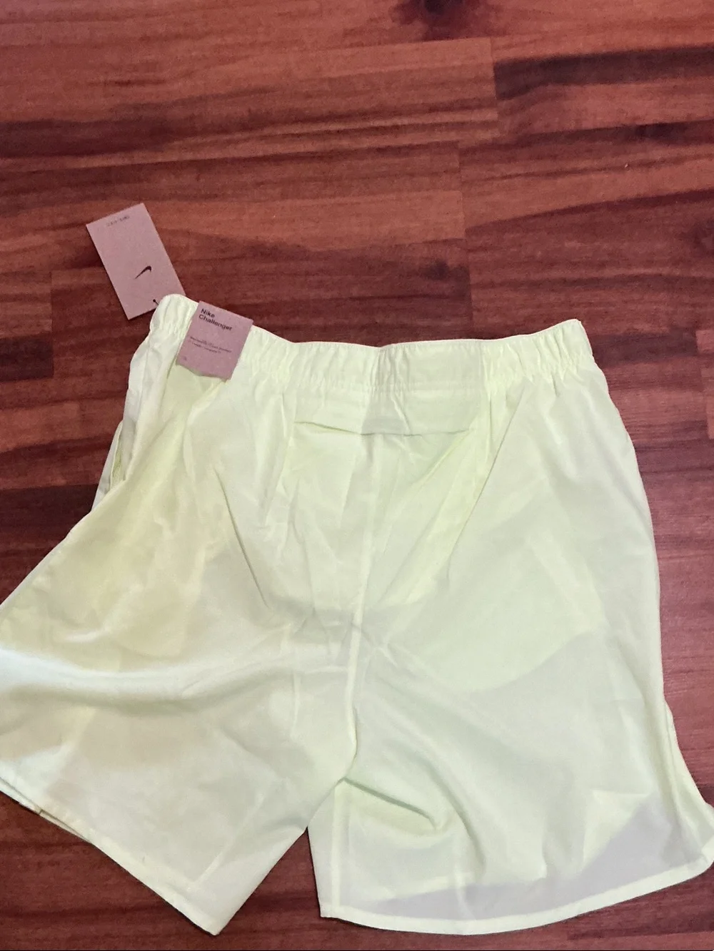 Nike men’s Pale Yellow Running Shorts with Reflective Swoosh nwt logo pockets
